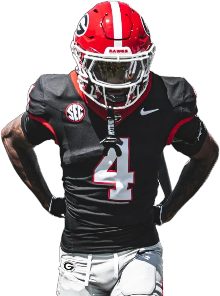 KJ Bolden in Georgia's black number 4 jersey, hands on his hips in the tunnel